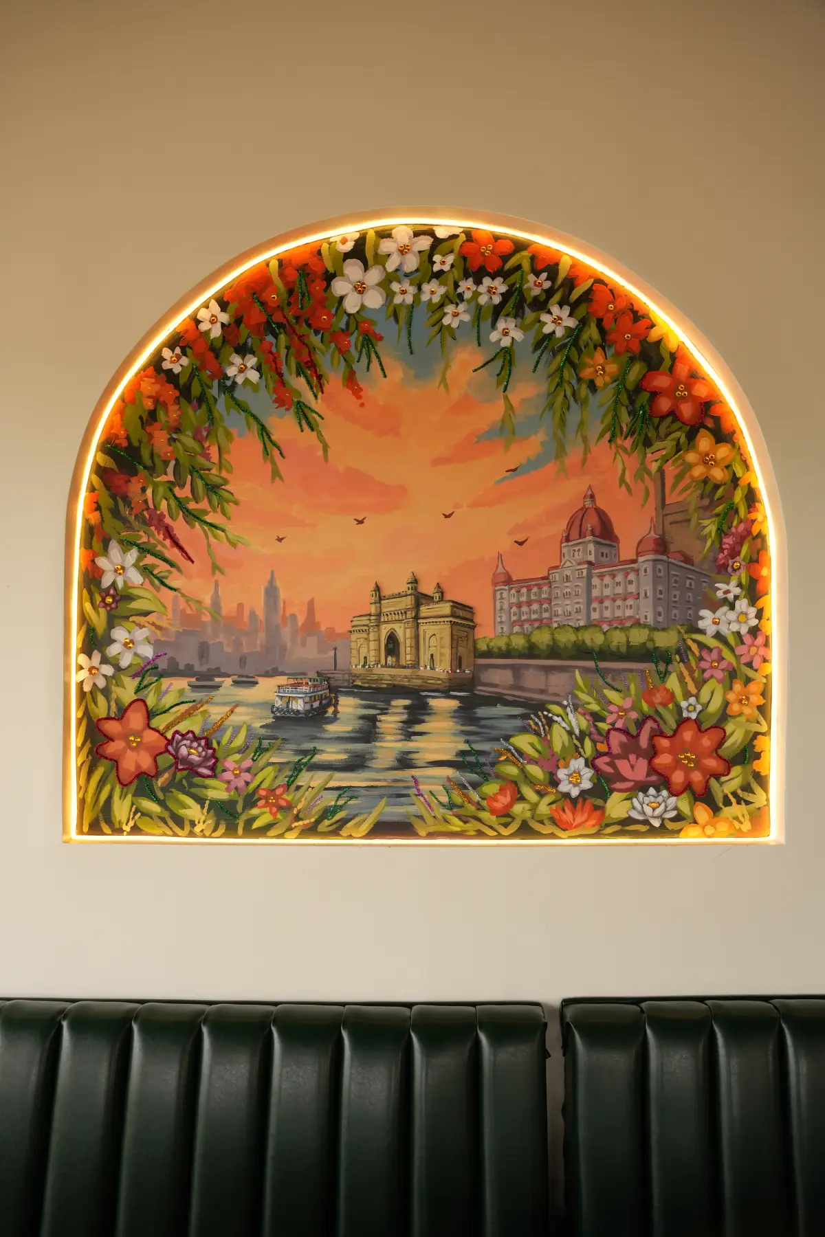 Beautiful painted wall mural of the Gateway of India in Mumbai framed with flowers