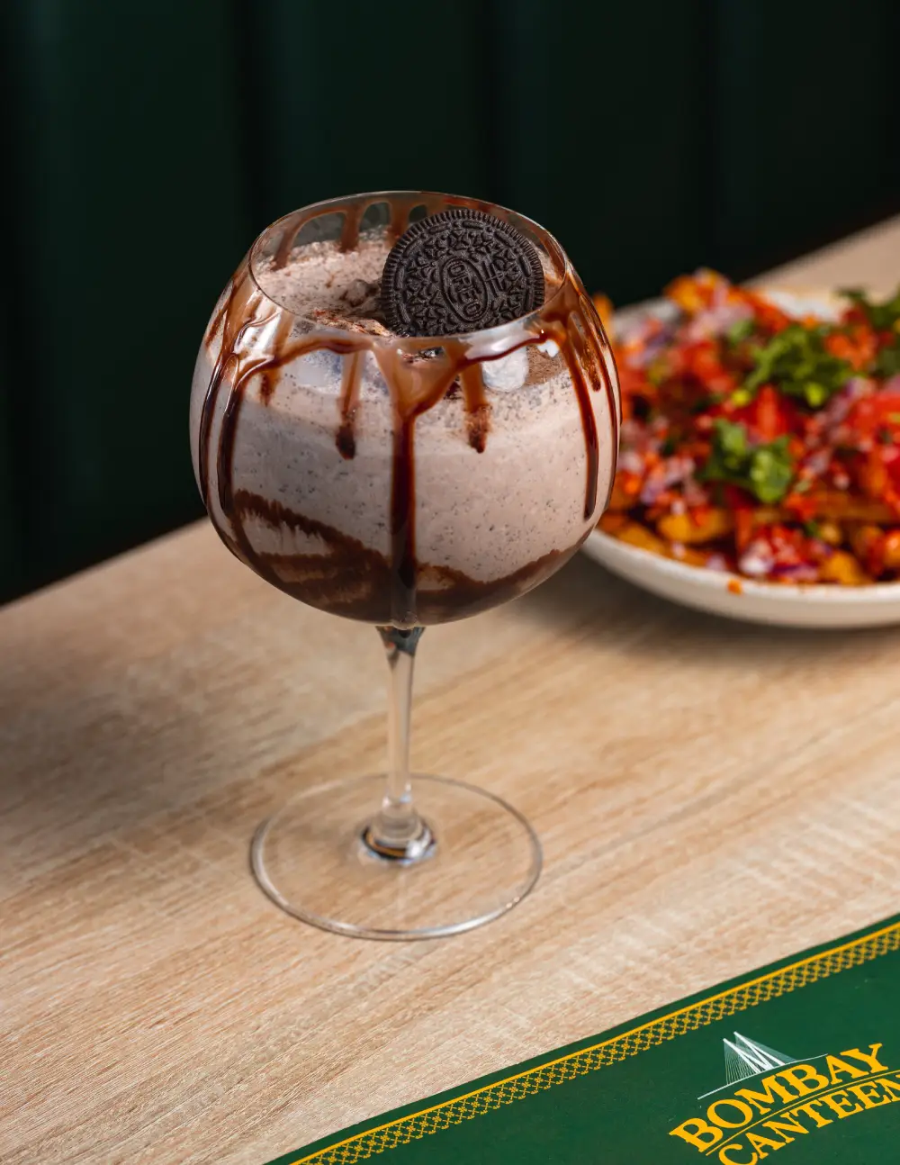 Thick chocolate Oreo milkshake topped with an Oreo cookie