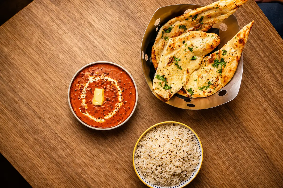 Authentic Indian meal featuring Dal Makhani, Jeera Rice, and Garlic Naan